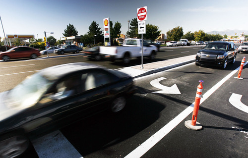 Francisco Kjolseth  |  The Salt Lake Tribune
To make the shopping centers at 5400 South and Redwood Road easily accessible, Taylorsville has installed a continuous flow intersection. New infrastructure improvements are part of a city effort to boost economic development.