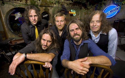 Douglas C. Pizac | Special to The Salt Lake Tribune
Revolver band members Jason Sawyer and Rick Herber sit in front, and John Davis, Paul Lovelady and Stephen Valdean at The Hog Wallow Pub.