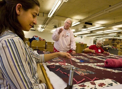 Mormons are expected to reach out to others. Here, workers labor at a Quilters Without Borders gathering at the LDS Humanitarian Center. Paul Fraughton /The Salt Lake Tribune 2008