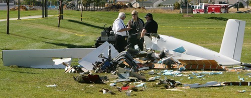 Steve Griffin  |  The Salt Lake Tribune


Authorities investigate the wreckage of a homemade, single-engine plane that crashed, after take-off,  in a West Jordan, soccer field, leaving one man dead and another critically injured Tuesday, Oct. 4, 2011. West Jordan Fire Battalion Chief Mark McElreath said the crash occurred about 1:20 p.m. at the Utah Youth Soccer Complex at 7930 S. 4000 West.