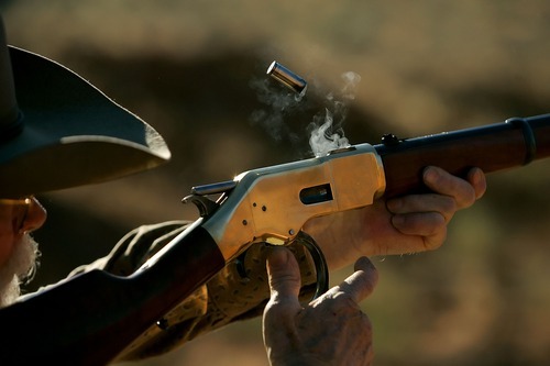 Tribune file photo
This  year marks the 25th anniversary of the Huntsman World Senior Games. In this photo from the 2006 games, a used bullet casing flies out of the chamber as Loyd Crume, aka 