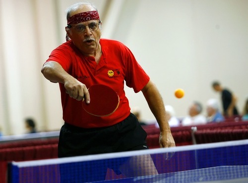Tribune file photo
This year marks the 25th anniversary of the Huntsman World Senior Games. In this photo from the 2006 games, a competitor returns the ping-pong ball during a match held at the Dixie Center.