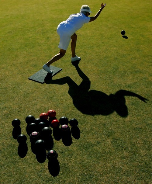 Tribune file photo
This year marks the 25th anniversary of the Huntsman World Senior Games. In this photo from the 2006 games, Patricia Walker, of Calgary, Alberta, rolls the bowl on the grass, trying to get it as close to the 