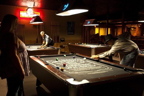 Chris Detrick  |  The Salt Lake Tribune
Ray Winward, right, plays pool at the Westerner Club.