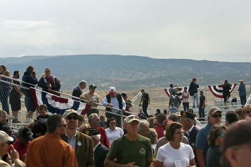 Chris Detrick  |  The Salt Lake Tribune
Spectators watch the ribbon cutting during the Grand Opening Celebration of the Quarry Exhibit Hall at Dinosaur National Monument on Tuesday, Oct. 4, 2011. The old Quarry Exhibit Hall was closed in July 2006 due to safety hazards. The Carnegie Quarry contains nearly 1,500 fossils.  In addition to the fossil wall, the facility features exhibits about dinosaurs and other life from the Jurassic period.