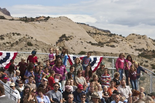 Chris Detrick  |  The Salt Lake Tribune
Spectators watch the ribbon cutting during the Grand Opening Celebration of the Quarry Exhibit Hall at Dinosaur National Monument on Tuesday, Oct. 4, 2011. The old Quarry Exhibit Hall was closed in July 2006 due to safety hazards. The Carnegie Quarry contains nearly 1,500 fossils.  In addition to the fossil wall, the facility features exhibits about dinosaurs and other life from the Jurassic period.