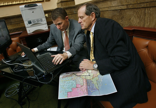 Scott Sommerdorf  |  The Salt Lake Tribune             
Rep. Brad Dee, R-Ogden, right, majority leader of the House, works with Leif Elder, a policy analyst with the office of legislative research and general counsel, on adjusting a redistricting map on the floor of the House.