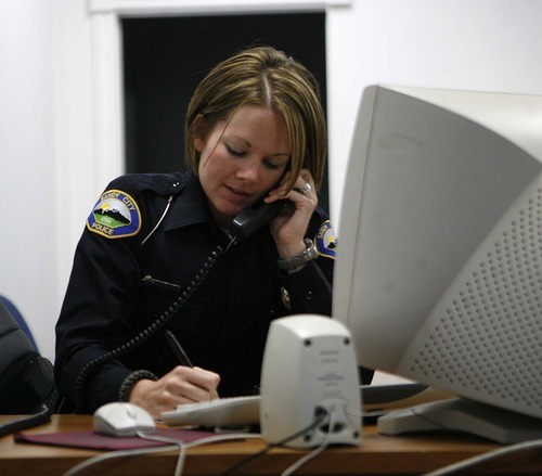 Trent Nelson  |  The Salt Lake Tribune
Officer Jessie Frampton follows up on a report in Sandy on Wednesday, Oct. 5, 2011.