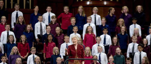 Jeremy Harmon  |  The Salt Lake Tribune

Backed by a choir of chlidren from Pleasant View and North Ogden, Vanja Y. Watkins leads the congregation in the hymn Praise to the Man during the Saturday afternoon session of the 181st Semiannual General Conference of The Church of Jesus Christ of Latter-day Saints.