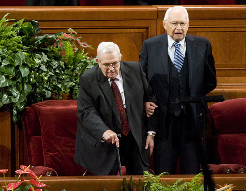Jeremy Harmon  |  The Salt Lake Tribune

Elder L. Tom Perry helps President Boyd K. Packer stand as they sing the hymn Praise to the Man during the Saturday afternoon session of the 181st Semiannual General Conference of The Church of Jesus Christ of Latter-day Saints.