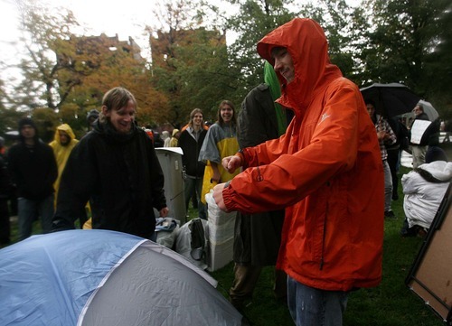 Leah Hogsten | The Salt Lake Tribune
Sunny Hawk, right, and his brother, Skyler, set up their tent in Pioneer Park where they plan on living in protest. Occupy SLC rallied on Capitol Hill on Thursday followed by a march through downtown Salt Lake City to Pioneer Park, where they set up a base camp and plan to remain until their voices are heard. The group opposes corporate greed and feels the government is out of touch with the people. They claim to be the 99 percent that has no voice.