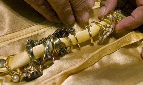 Steve Griffin  |  The Salt Lake Tribune
Carol and Bob Mahoney were victims of at least $8,000 in jewelry theft. The two are fighting to change the pawn shop laws that only require shops to hold jewelry for 15 days. By the time detectives located their jewelry, they say the pawn shop had disposed of $5,000 worth including an heirloom piece. Here Bob Mahoney at their Kearns home looks through some of the jewelry that was recovered following the robbery.
