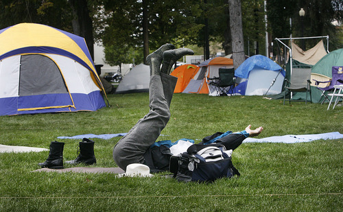Scott Sommerdorf  |  The Salt Lake Tribune             
One of the Occupy SLC campers (who chose not to be identified) does a yoga routine in the 