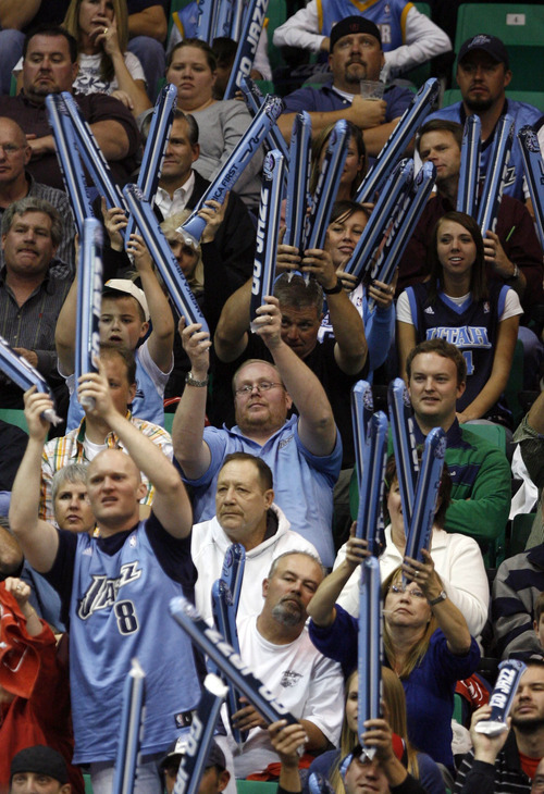 Tribune file photo
Jazz fans pound inflatable noise makers together as the try to disrupt Allen Iverson of the Nuggets as he shoots free throws during the Jazz NBA home opener against the Denver Nuggets at EnergySolutinos Arena in 2008.