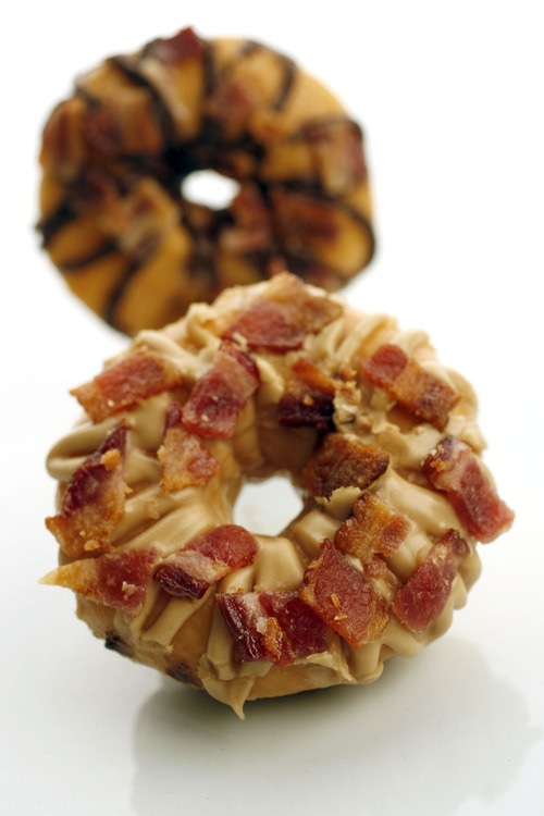 Francisco Kjolseth  |  The Salt Lake Tribune
Bacon isn't just for breakfast anymore. Many bakeries are putting this sizzling meat in desserts. Some of these sweet bacon treats include a maple bacon doughnut and maple/milk chocolate cookies both made with bacon. Some chocolate bars are also being infused with bacon for a bittersweet salty taste.
