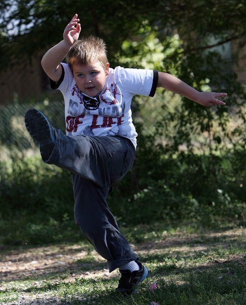 Steve Griffin  |  The Salt Lake Tribune
Eight-year-old Braxton Longman follows through on a kick as he plays soccer with his mother and grandmother at their Bluffdale home in late September.