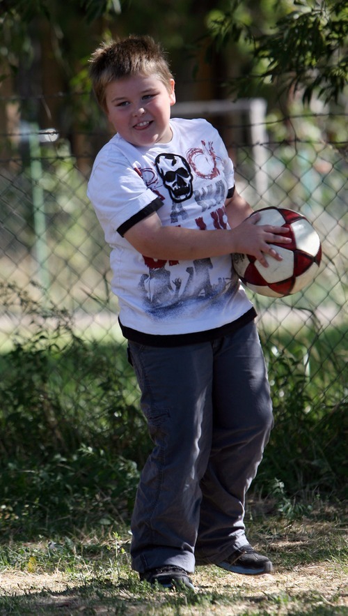 Steve Griffin  |  The Salt Lake Tribune
Eight-year-old Braxton Longman plays soccer with his mother and grandmother at their  Bluffdale home in late September.