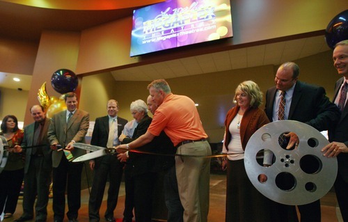 Steve Griffin  |  The Salt Lake Tribune


Gail Miller and son Greg Miller, owner and CEO of Larry H. Miller Group, use giant pair of scissors as they cut film during the opening of the new Megaplex Theatre at Legacy Crossing, in Centerville, Utah Thursday, October 13, 2011.
