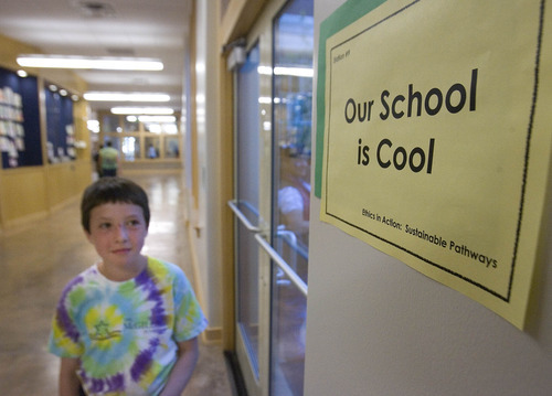 Paul Fraughton | The Salt Lake Tribune
Benjamin, a student at The McGillis School in Salt Lake City, eyes a sign Friday, Oct. 14, as he walks down a hallway. The McGillis School was awarded a  Gold LEED certificate for its green building practices employed in the expansion of the school building.