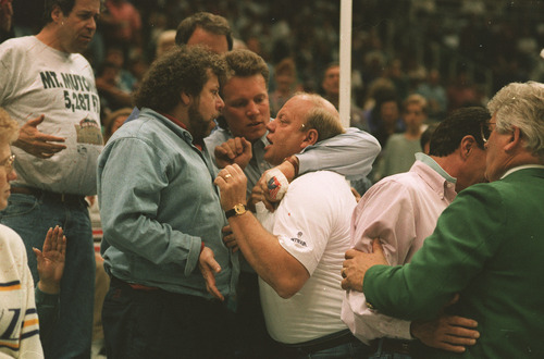 Tribune file photo

Jazz owner Larry H. Miller gets into an argument with a Nuggets fan during a game in 1994.