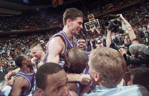 Tribune file photo

Utah Jazz's John Stockton is lifted on the shoulders of his teammates after sinking a three-point shot at the buzzer to beat the Houston Rockets 103-100 in Game 6 of the Western Conference Finals Thursday, May 29, 1997, in Houston. The Jazz advanced to play the Chicago Bulls in The NBA Finals.
