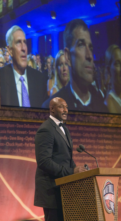 Tribune file photo

With images of Coach Jerry Sloan and John Stockton above him Karl Malone speaks as he is inducted into the Naismith Memorial Basketball of Fame in Springfield Massachussetts in 2010.