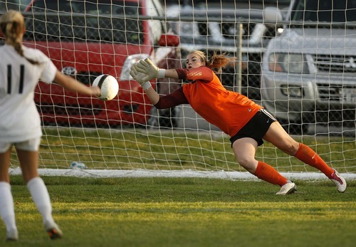 Trent Nelson  |  The Salt Lake Tribune
Bountiful goalkeeper Carley Longhurst blocks a shot by Skyline's Rachel Wright, during the shootout. Skyline defeats Bountiful in a shootout, high school soccer playoffs, in Herriman, Utah, Thursday, October 13, 2011.