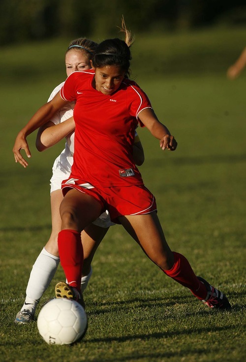 Trent Nelson  |  The Salt Lake Tribune
Bountiful's Elena Medeiros controls the ball ahead of Skyline's Rachel Wright. Skyline defeats Bountiful in a shootout, high school soccer playoffs, in Herriman, Utah, Thursday, October 13, 2011.