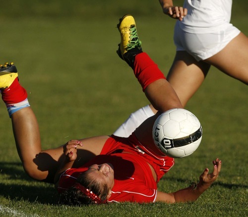 Trent Nelson  |  The Salt Lake Tribune
Bountiful's Shaylee Petersen takes a tumble while driving to the goal. Skyline defeats Bountiful in a shootout, high school soccer playoffs, in Herriman, Utah, Thursday, October 13, 2011.