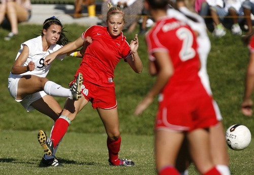 Trent Nelson  |  The Salt Lake Tribune
Skyline's Ashley Aberton knocks the ball around Bountiful's Leah Wood. Skyline defeats Bountiful in a shootout, high school soccer playoffs, in Herriman, Utah, Thursday, October 13, 2011.