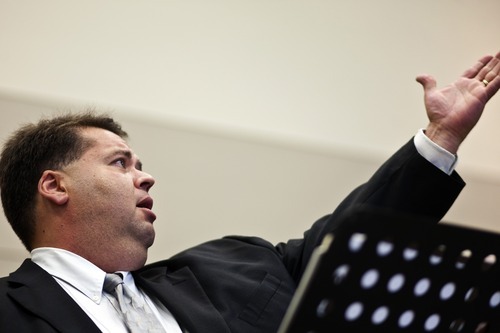 Chris Detrick  |  The Salt Lake Tribune
Mormon Tabernacle Choir member Laurent Neu sings at the 22nd Annual Families and Professionals Conference sponsored by the Brain Injury Association of Utah at the South Towne Expo Center on Thursday Oct. 13, 2011.