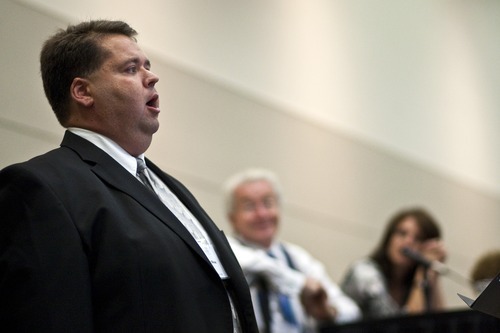 Chris Detrick  |  The Salt Lake Tribune
Mormon Tabernacle Choir member Laurent Neu sings at the 22nd Annual Families and Professionals Conference sponsored by the Brain Injury Association of Utah at the South Towne Expo Center on Thursday, Oct. 13, 2011.