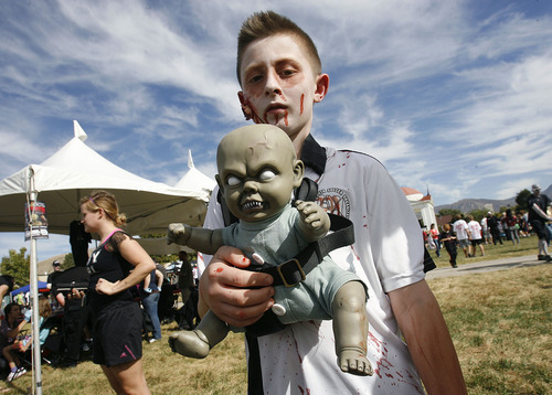 Scott Sommerdorf  |  The Salt Lake Tribune             
Ten-year-old Eastin Hartzell of Ogden with his undead baby friend 