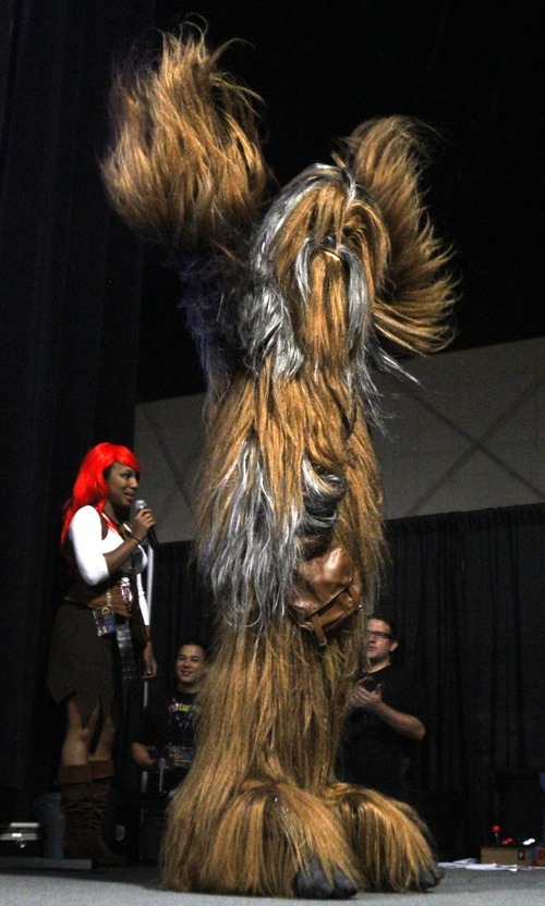 Rick Egan  | The Salt Lake Tribune 

Dartanyon Richards took second place with his performance of Chewbacaa from Star Wars,  in the Cosplay competition, at the Geex convention, at the South Towne Expo Center, Saturday, October 15, 2011. The GEEX convention is a two-day convention sponsored by MediaOne that's about video games and geek culture.