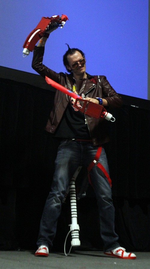 Rick Egan  | The Salt Lake Tribune 

Colby Paul performs as Travis Touchdown from No More Heroes in the Cosplay competition, at the Geex convention, at the South Towne Expo Center, Saturday, October 15, 2011. The GEEX convention is a two-day convention sponsored by MediaOne that's about video games and geek culture.