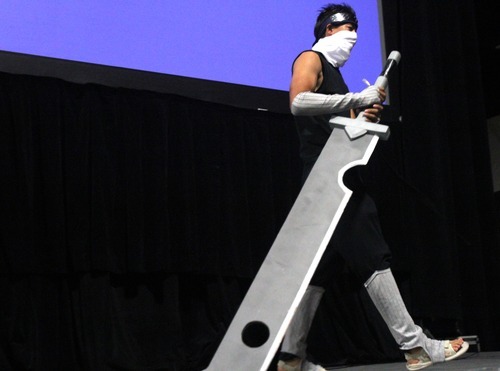 Rick Egan  | The Salt Lake Tribune 

Bryan Chau performs Naruto the ultimate ninja from Zabuza in the Cosplay competition at the Geex convention at the South Towne Expo Center, Saturday, October 15, 2011. The GEEX convention is a two-day convention sponsored by MediaOne that's about video games and geek culture.