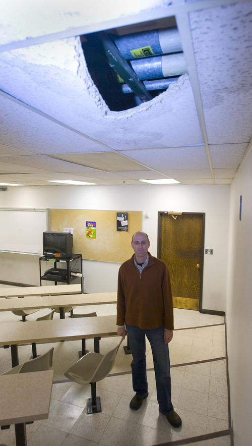 Al Hartmann  |  Tjhe Salt Lake Tribune   11/30/2009
Dr. Neil Vickers Professor in the  Biology Department at the University of Utah stands in one of four first floor classrooms in the 70 year old Life Sciences building that has been closed due to water damage.  Overhead water pipes that run above the ceiling tiles have been leaking.
