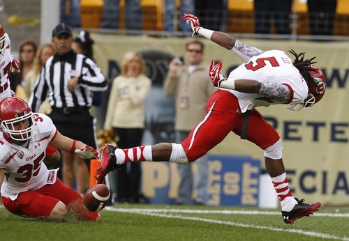 Trent Nelson  |  The Salt Lake Tribune
Utah's Greg Bird (35) and Mo Lee (5) down a punt at the one-yard line during the first half. Utah vs. Pitt, college football at Heinz Field Stadium in Pittsburgh, Pennsylvania, Saturday, October 15, 2011.