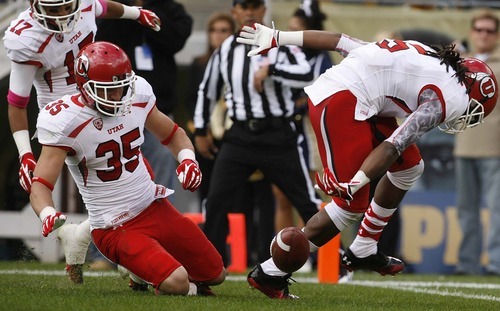 Trent Nelson  |  The Salt Lake Tribune
Utah's Greg Bird (35) and Mo Lee (5) down a punt at the one-yard line during the first half. Utah vs. Pitt, college football at Heinz Field Stadium in Pittsburgh, Pennsylvania, Saturday, October 15, 2011.