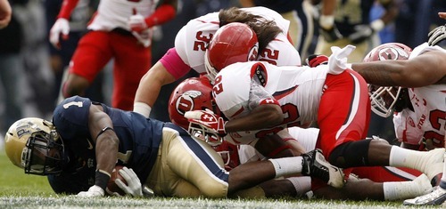 Trent Nelson  |  The Salt Lake Tribune
Utah defenders Chaz Walker (32) and Ryan Lacy (26) tackle Pitt running back Ray Graham during the first half. Utah vs. Pitt, college football at Heinz Field Stadium in Pittsburgh, Pennsylvania, Saturday, October 15, 2011.