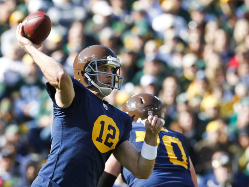 Green Bay Packers quarterback Aaron Rodgers (12) passes against the St. Louis Rams during the second half of an NFL football game Sunday, Oct. 16, 2011, in Green Bay, Wis. The Packers won 24-3. (AP Photo/Jeffrey Phelps)