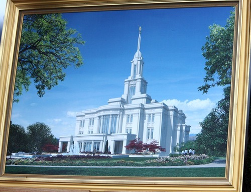 Steve Griffin  |  The Salt Lake Tribune


Thousands of LDS faithful braved the rainy weather as they attended a groundbreaking ceremony for the Payson Temple in Payson, Utah Saturday, October 8, 2011. This painting of the Temple was on display during the event.