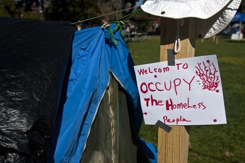 Chris Detrick  |  The Salt Lake Tribune
A sign outside of a tent at the Occupy SLC camp at Pioneer Park Tuesday October 18, 2011.