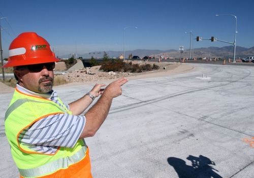 Rick Egan  | The Salt Lake Tribune 

Tim Rose, Utah Department of Transportation, explains how the traffic will flow at the new diverging diamond interchange at the intersection of Bangerter Highway and SR 201.