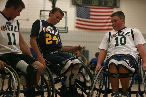 Leah Hogsten | The Salt Lake Tribune
Spencer Heslop, 17, tries to pass teammates Sam Blakley (left) and Marshall Lindsay -- fellow members of the Wheelin' Jazz basketball team -- at the Sorenson Multicultural Center. Heslop is a Clearfield High senior who just returned from the Netherlands, where he participated in a Paralympic camp.