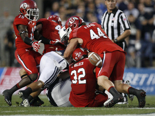 Trent Nelson | Tribune file photo
Utes play against BYU at Lavell Edwards Stadium in Provo in September.