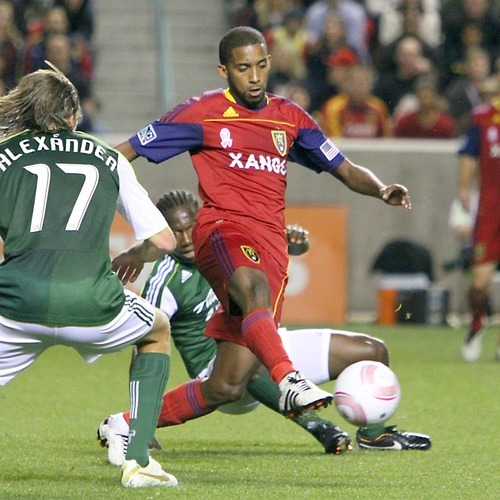 Stephen Holt/ Special to the Tribune
Real Salt Lake midfielder Yordany Alvarez breaks through the Portland midfield during the first half at Rio Tinto Stadium in Sandy.