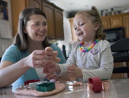 Al Hartmann  |  The Salt Lake Tribune
Eden Lai, 3, makes play dough cookies with her mother Erica in their Spanish Fork home.  As a 1-year-old Eden's liver was failing and she needed a transplant. Though her liver was failing, she wasn't one of the sickest patients. So her mother decided to give a portion of her own liver to save her daughter.
