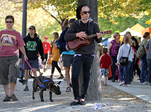 Lennie Mahler  |  The Salt Lake Tribune
Zac Smith plays the ukulele and harmonica at the Downtown Farmers Market on Saturday, Oct. 22, 2011. The weekly farmers market wrapped up for the season.