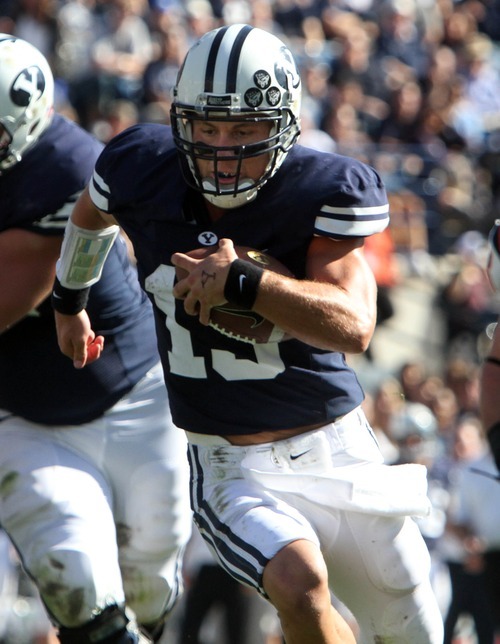 Rick Egan  | The Salt Lake Tribune 

Brigham Young Cougars quarterback Riley Nelson (13) runs for a touchdown in football action,  BYU vs. Idaho State University football game, at Lavell Edwards Stadium, Saturday, October 22, 2011.